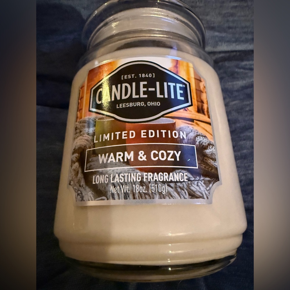 Candle-lite 18 ounce candle “Warm and Cozy” NEW UNUSED Burn time 70-110 hours